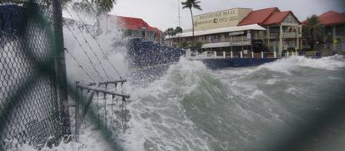 Waves crash against a seawall as Hurricane Ian passes through George Town, Grand Cayman island, Monday, Sept. 26, 2022. (AP Photo/Kevin Morales)